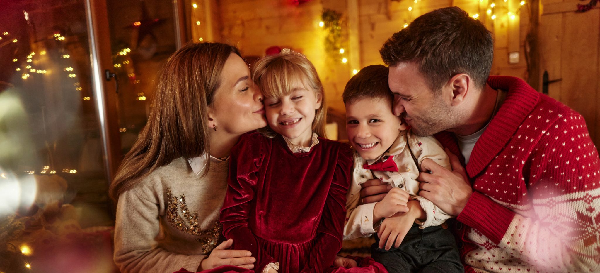 Kissing family at holiday time